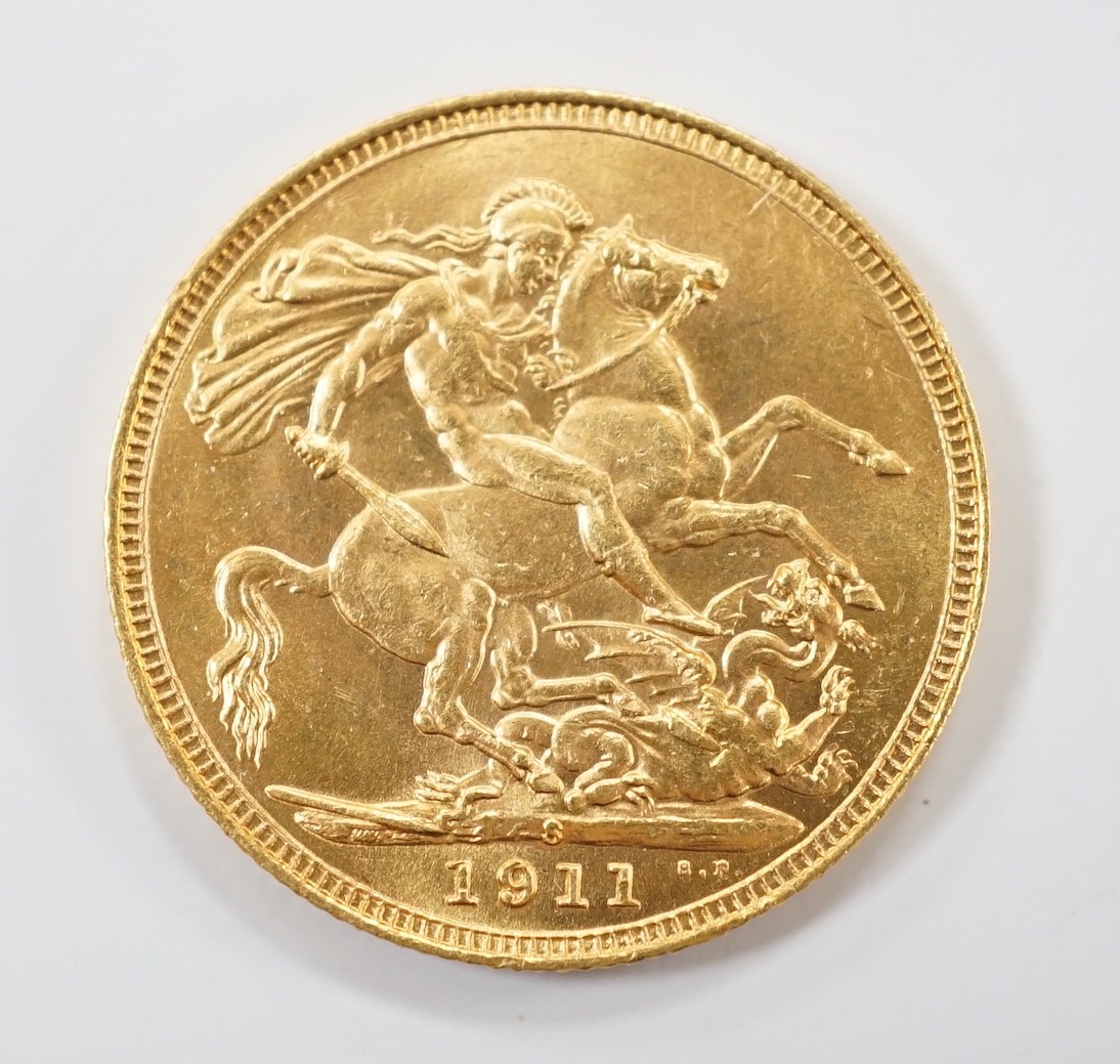 A George V gold sovereign 1911S, in case